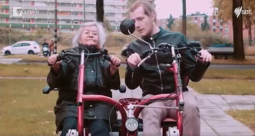 Old lady and young student on a joint scooter